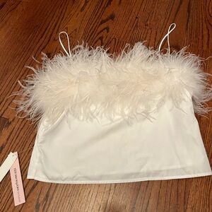 Bloomingdale’s aqua brand white top with feathers. New with tags on Never worn.